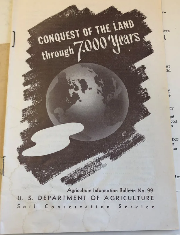 Walter Lowdermilk's pamphlet about agriculture in Palestine and beyond, with a black and white earth on it